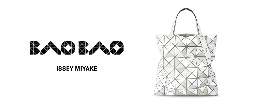  White background. Left: BAO BAO ISSEY MIYAKE logo in black. Right: Upright QUATRO tote bag in white, looks shimmery.