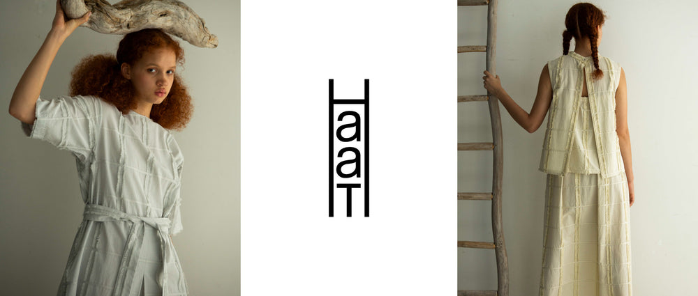 Left: Model wearing YUUKI COTTON short-sleeved dress in grey. Shot from hips up, holding a log above their head. Centre: HaaT logo in black on white background. Right Model with their back to the camera, wearing YUUKI COTTON top and skirt in ivory. Holding a wooden ladder.