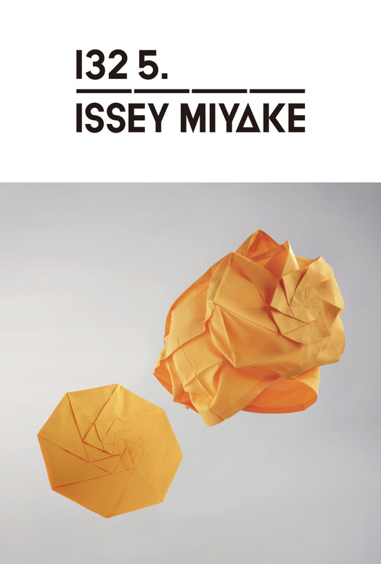 Top: 132 5. ISSEY MIYAKE logo in black on white background. Bottom: Two NO.7 tops in marigold suspended in mid air. One folded flat in a circular shape and one unfolded in a spherical shape. Against light grey background.