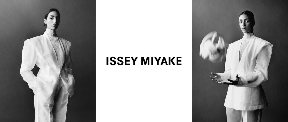 Left: Model posing with their hands in their pockets. Wearing TRANSLUCENT SUIT jacket and trousers in white. Photo is black and white and shot from their ankles up. Centre: ISSEY MIYAKE logo in black on white background. Right: Model in the TRANSLUCENT SUIT, throwing a BREAD ACC bag in white in the air. Photo is black and white.