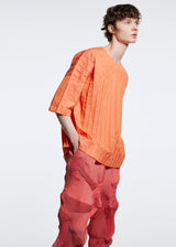 A model wears the A POC ABLE ISSEY MIYAKE  TYPE W 007 top