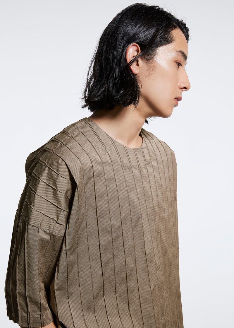 A model wears the A POC ABLE ISSEY MIYAKE  TYPE W 007 top