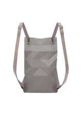 A detail shot of the BAO BAO ISSEY MIYAKE TRACK backpack.