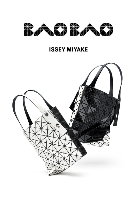 White background. Top: BAO BAO ISSEY MIYAKE logo in black. Bottom: Two "jumping" DUO tote bags in black and white. One has white side toward camera and the other has black.  