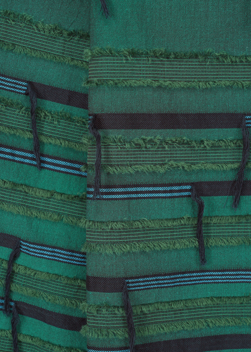 A detail shot of the HAAT  FRINGE MIXED skirt