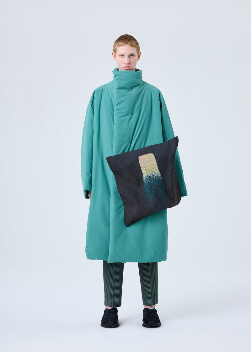 A model wears the HOMME PLISSÉ ISSEY MIYAKE RB_STYLO BILLE CUSHION COAT coat.