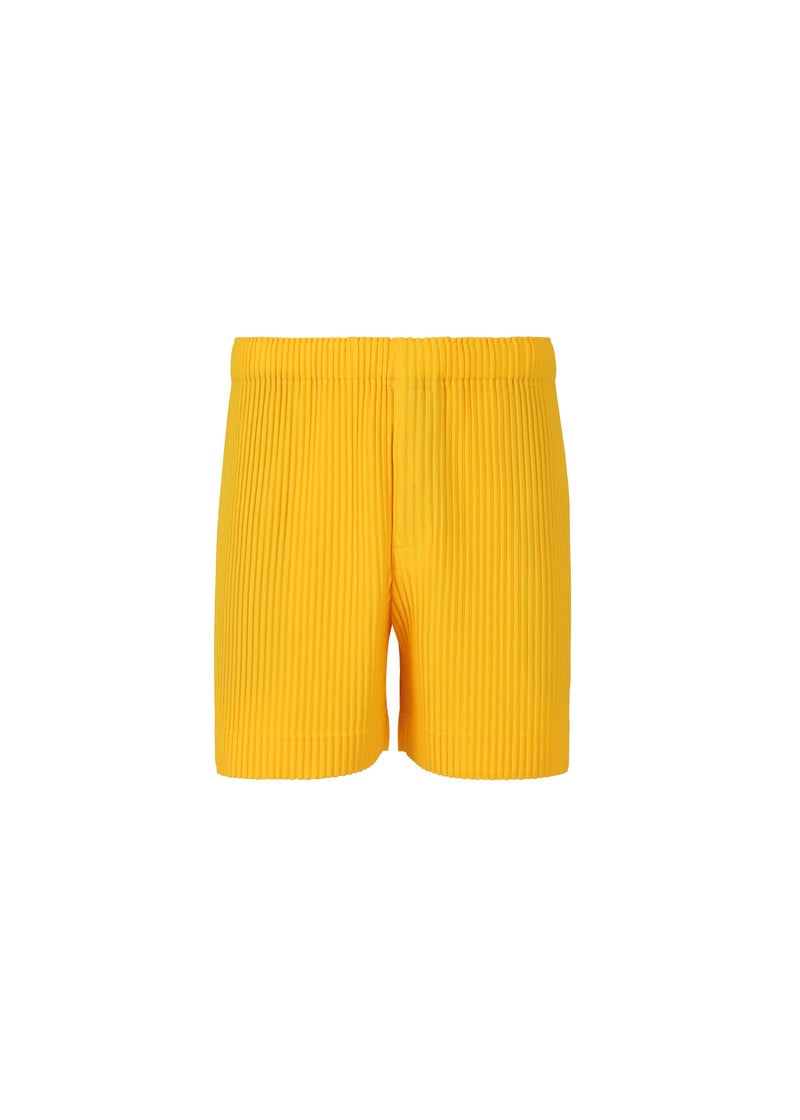 A product shot of the HOMME PLISSÉ ISSEY MIYAKE  MC JULY shorts in yellow (52)