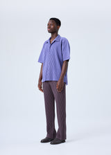 A model wears the HOMME PLISSÉ ISSEY MIYAKE  MC JULY shirt