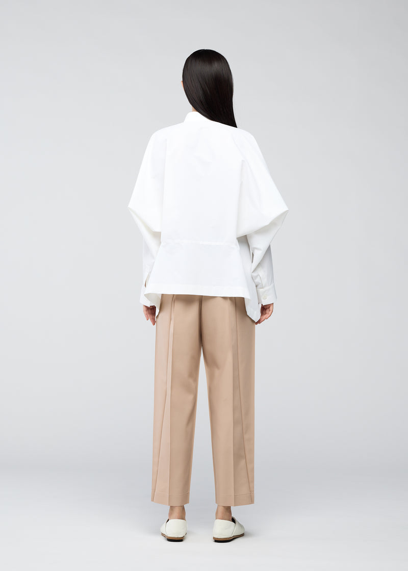 A model wears the 132 5. ISSEY MIYAKE  TRAPEZOID SHIRT shirt