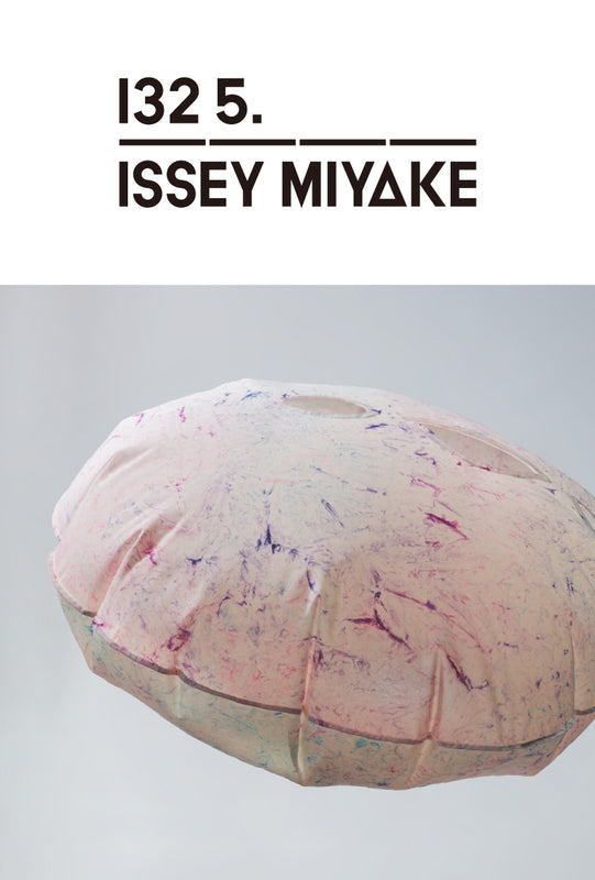 Bottom: BUBBLE DYE Dress print with pink base inflated into bubble shape and floating in midair. Top: 132 5. ISSEY MIYAKE logo in black on white background.