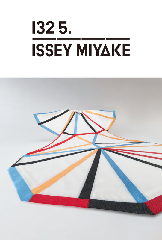 Bottom: DIMENSIONS white dress with blue, black, red and yellow stripes, spread out on white floor. Top part is raised to show collar and sleeves. Top: 132 5. ISSEY MIYAKE logo in black on a white background.