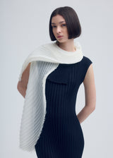 A model wears the ISSEY MIYAKE  SILK WOOL PLEATS STOLE stole