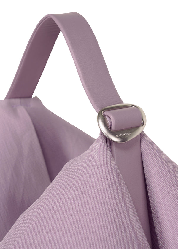 A detail shot of the ISSEY MIYAKE  ENCLOTHE SQUARE bag