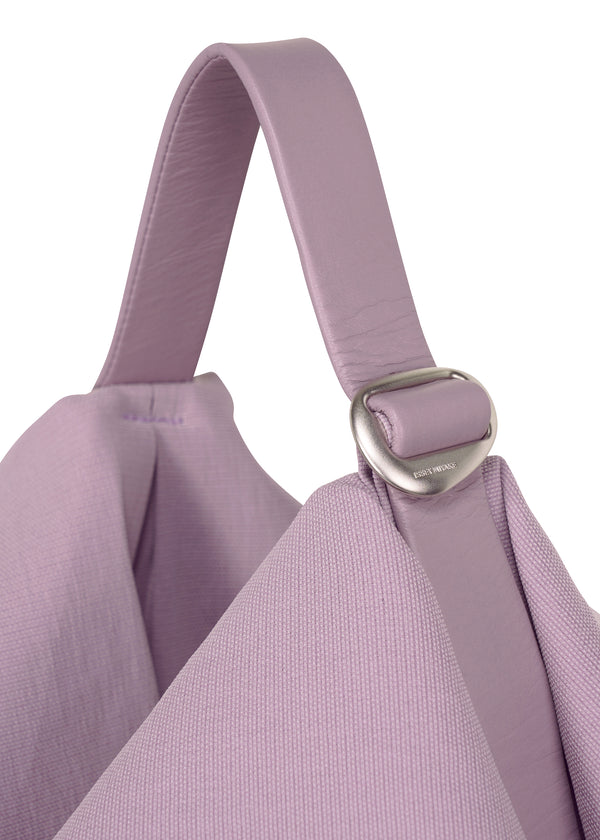 A detail shot of the ISSEY MIYAKE  ENCLOTHE SQUARE bag