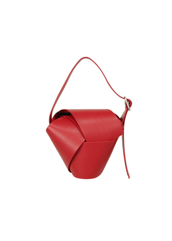 A product shot of the ISSEY MIYAKE BAND BIND BAG bag in nadeshiko red (29).