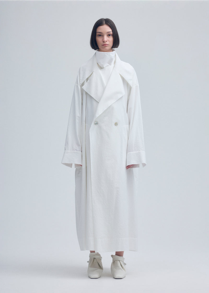 A model wears the ISSEY MIYAKE  KHADI LAYERED coat