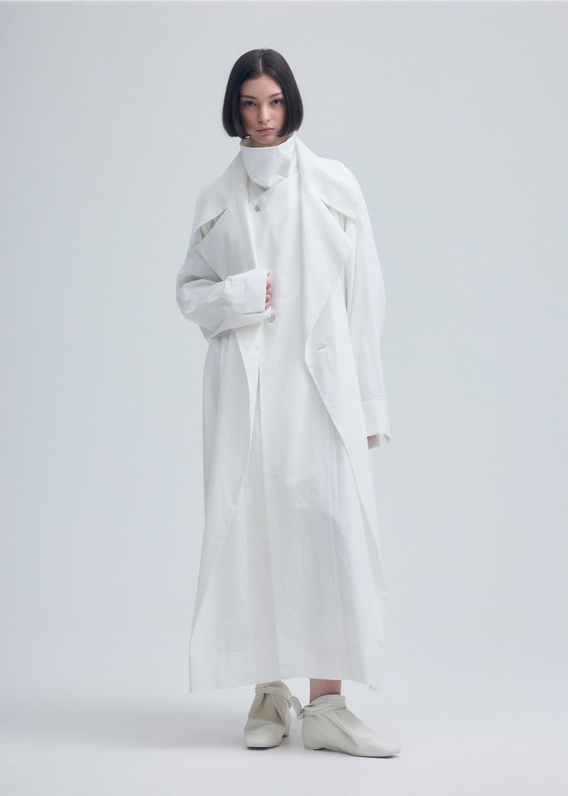 A model wears the ISSEY MIYAKE  KHADI LAYERED coat