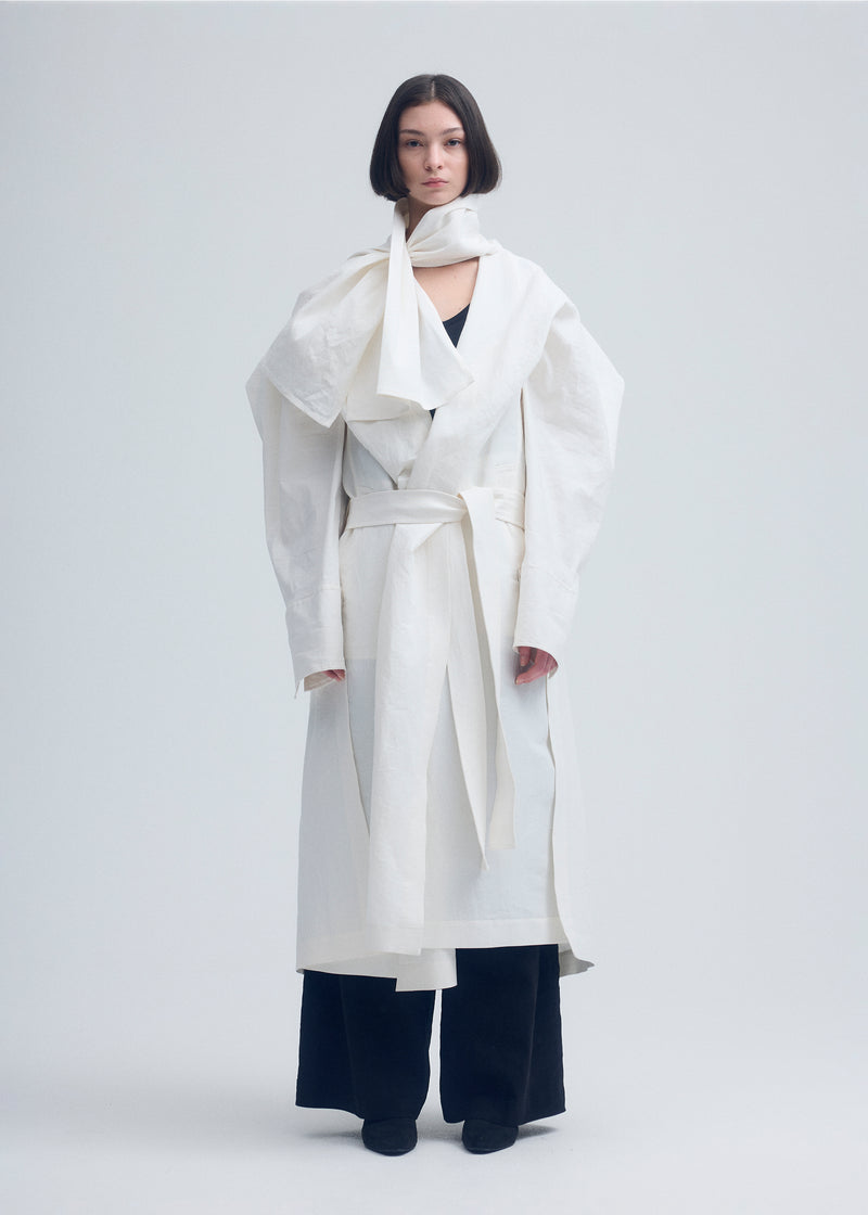 A model wears the ISSEY MIYAKE  ENCLOTHE coat