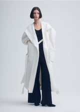 A model wears the ISSEY MIYAKE  ENCLOTHE coat