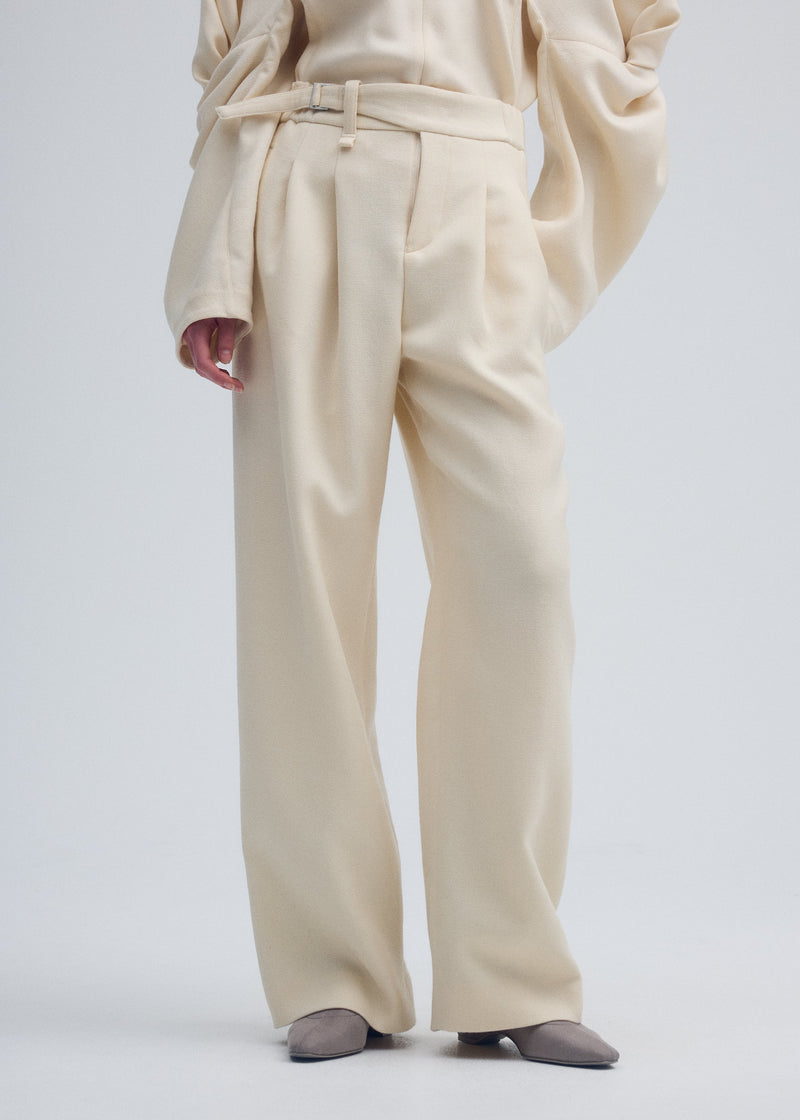 A model wears the ISSEY MIYAKE ENTWINE trousers.