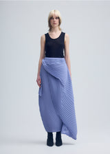 A model wears the ISSEY MIYAKE  WRAPPED PLEATS skirt