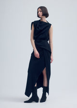 A model wears the ISSEY MIYAKE ENTWINE dress.