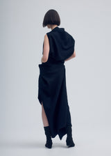 A model wears the ISSEY MIYAKE ENTWINE dress.