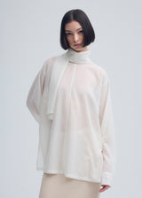 A model wears the ISSEY MIYAKE  SHEER WOOL shirt