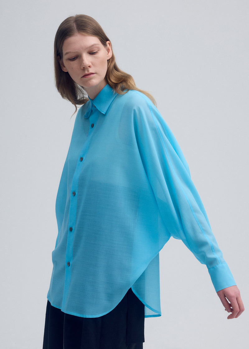 A model wears the ISSEY MIYAKE  SHEER WOOL shirt