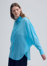 A model wears the ISSEY MIYAKE  SHEER WOOL shirt