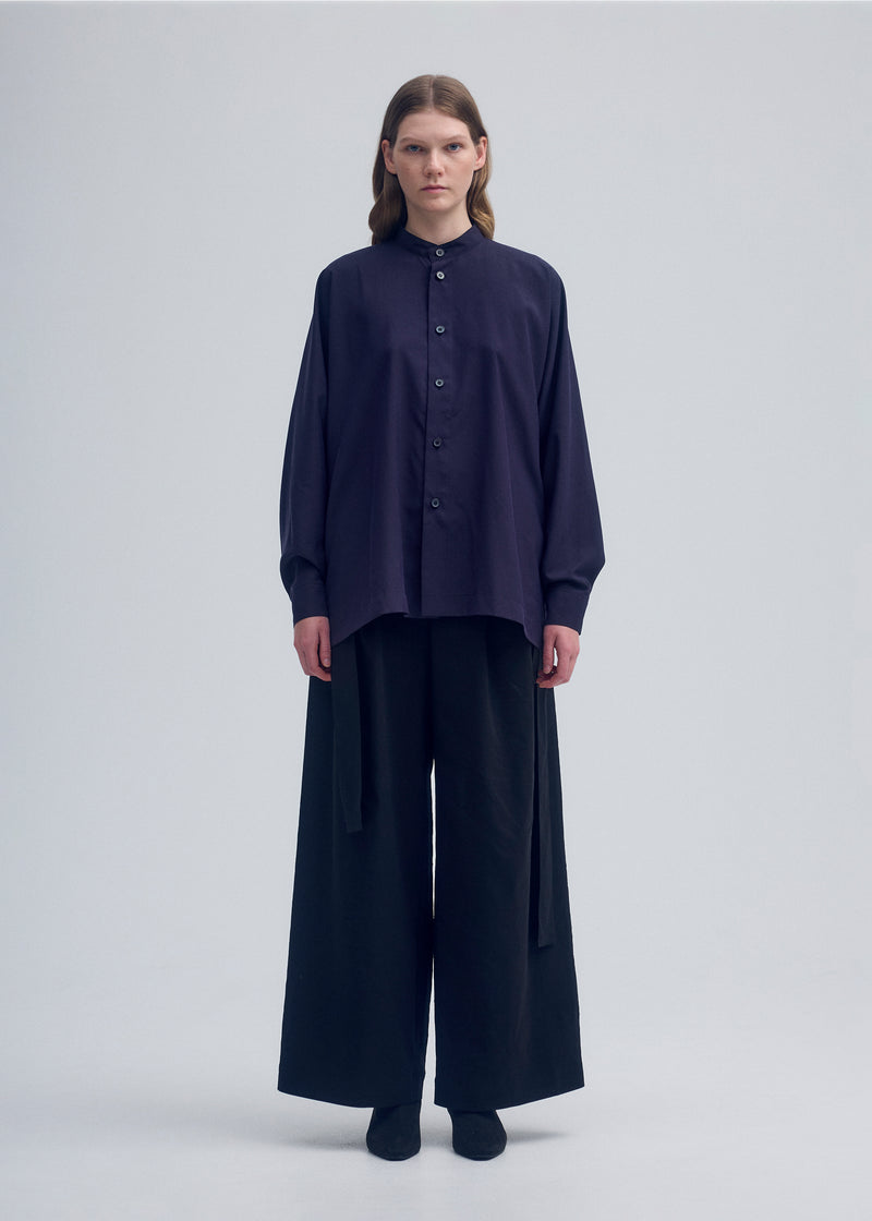 A model wears the ISSEY MIYAKE  ENCLOTHE SILK shirt