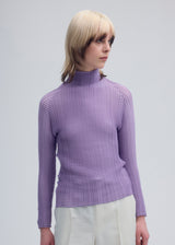 A model wears the ISSEY MIYAKE  WOOLY PLEATS 48 top