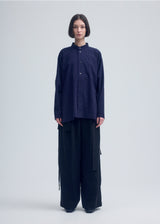 A model wears the ISSEY MIYAKE  KHADI LAYERED shirt