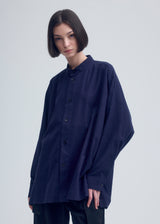 A model wears the ISSEY MIYAKE  KHADI LAYERED shirt