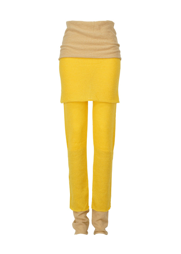 A product shot of the ISSEY MIYAKE INTERPLAY trousers in yellow-hued (57).