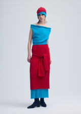 A model wears the ISSEY MIYAKE INTERPLAY skirt.