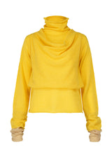 A product shot of the ISSEY MIYAKE INTERPLAY top in yellow-hued (57).