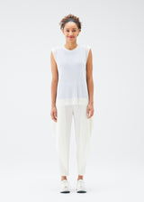 A model wears the PLEATS PLEASE ISSEY MIYAKE  TATAMI JULY top