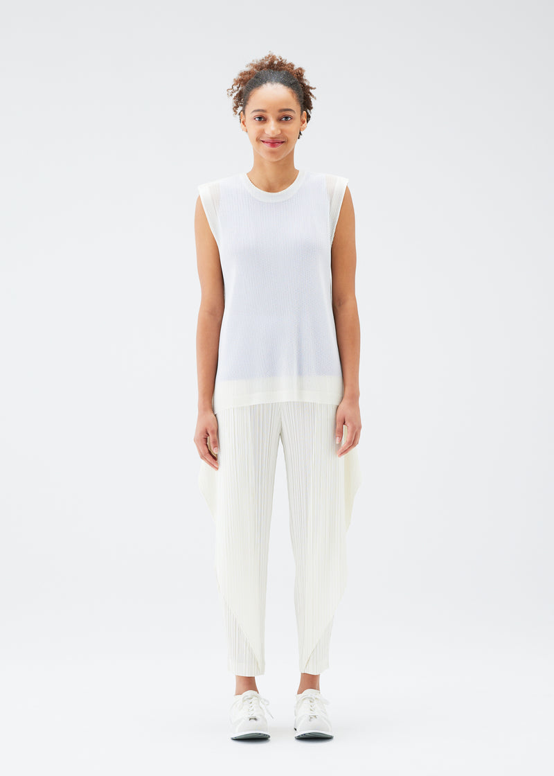 A model wears the PLEATS PLEASE ISSEY MIYAKE  TATAMI JULY top