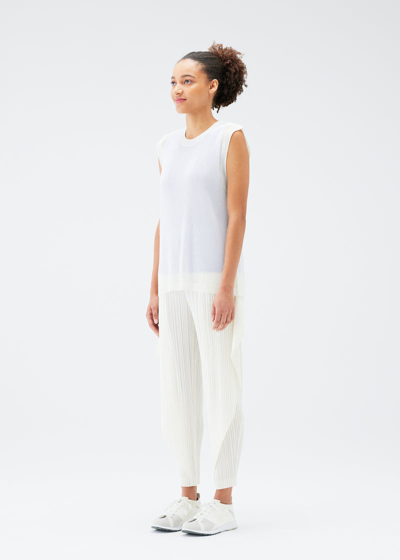 A model wears the PLEATS PLEASE ISSEY MIYAKE  TATAMI JULY top