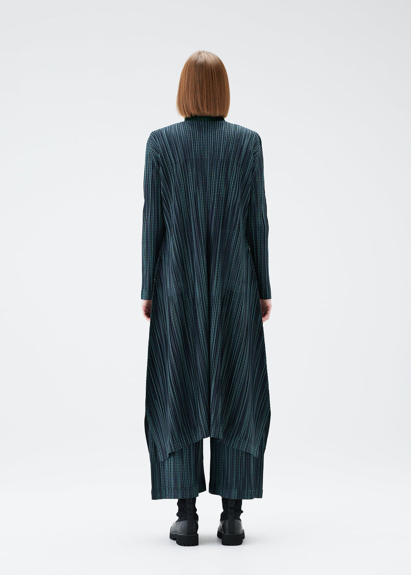 A model wears the PLEATS PLEASE ISSEY MIYAKE METEOR SHOWER coat.