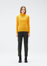 A model wears the PLEATS PLEASE ISSEY MIYAKE METEOR SHOWER trousers.