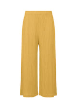 A product shot of the PLEATS PLEASE ISSEY MIYAKE  THICKER BOTTOMS 1 trousers in ochre (56)