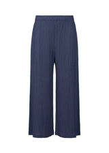 A product shot of the PLEATS PLEASE ISSEY MIYAKE  THICKER BOTTOMS 1 trousers in navy (75)