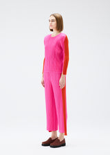 A model wears the PLEATS PLEASE ISSEY MIYAKE  COMET trousers