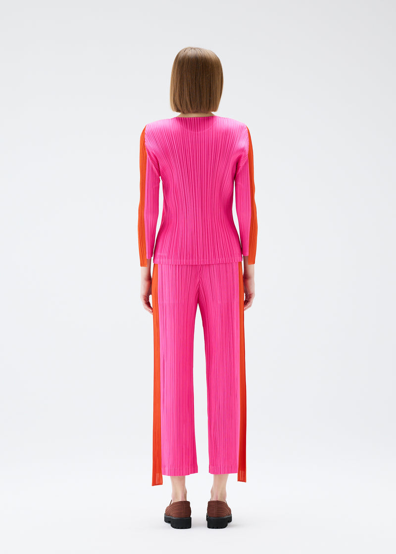 A model wears the PLEATS PLEASE ISSEY MIYAKE  COMET trousers