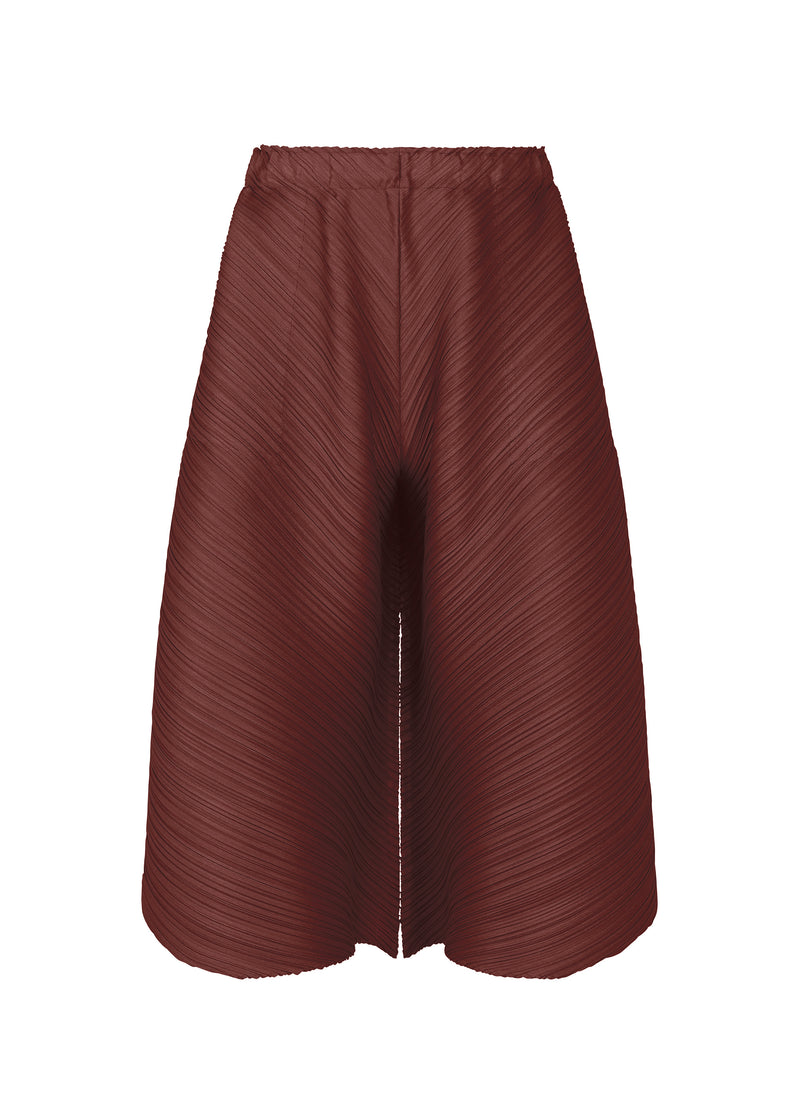 A product shot of the PLEATS PLEASE ISSEY MIYAKE  SOLAR FLARE trousers in bordeaux (84)