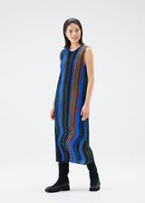 A model wears the PLEATS PLEASE ISSEY MIYAKE WARP dress.