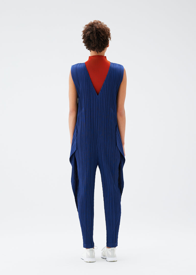 A model wears the PLEATS PLEASE ISSEY MIYAKE  THICKER BOTTOMS 1 jumpsuit