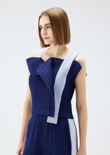 A model wears the PLEATS PLEASE ISSEY MIYAKE  COMET top